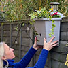 Revolutionary 4-in-1 Self-Watering Fence Planter and Solar Light - Brown
